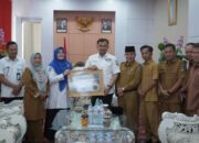 Kepesertaan Capai 100%, Pemkab Dharmasraya Terima Penghargaan dari BPJS Kesehatan